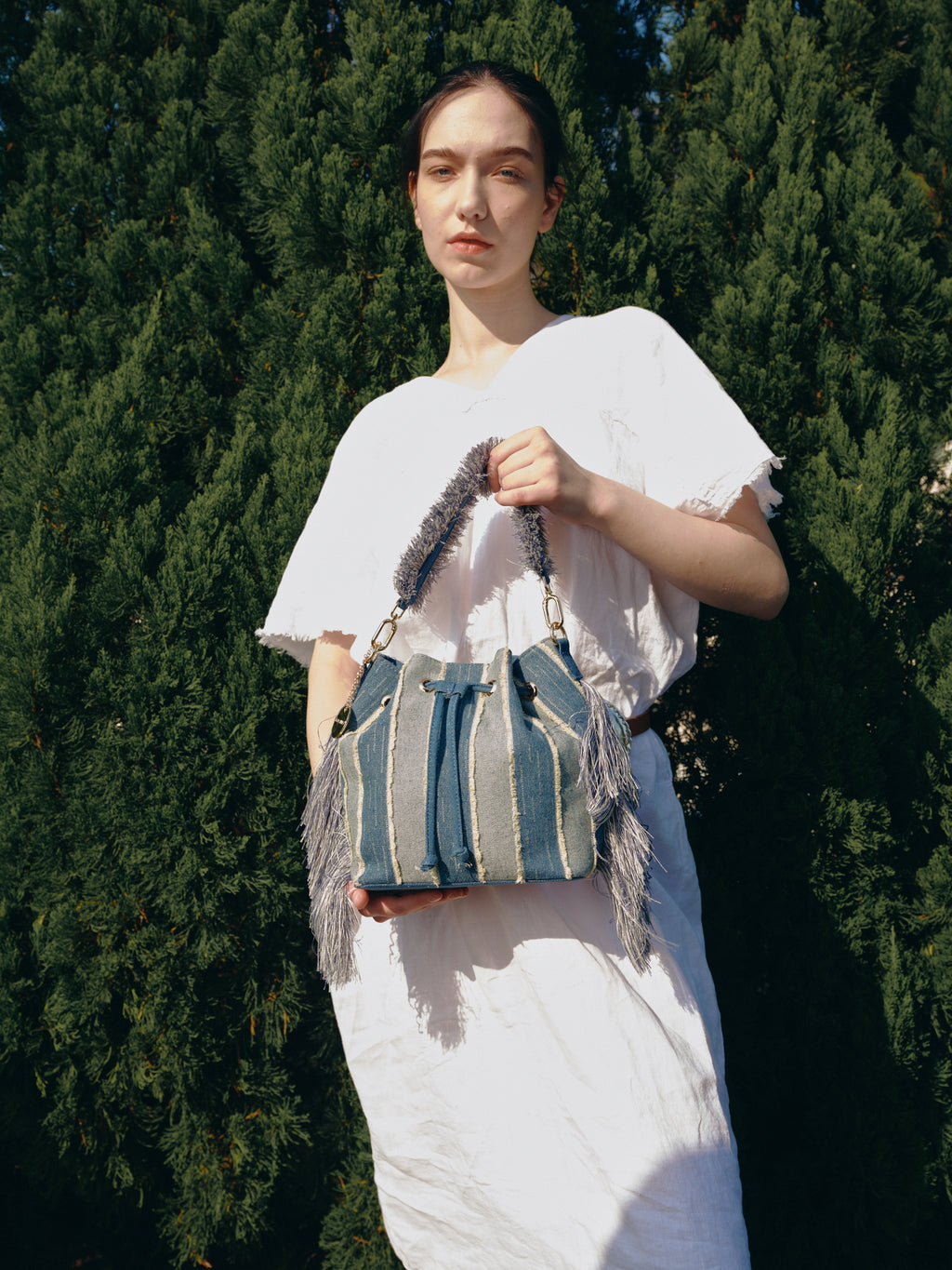 KASSANDRA Fringe Denim Bucket Bag with Striped Design