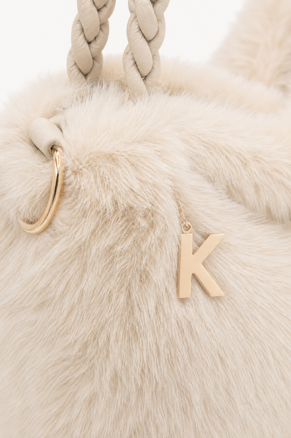 Borsa hobo effetto pelliccia con manico intrecciato Beige