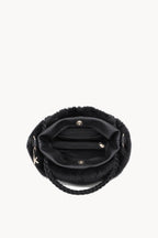 Kassandra & Co Borsa hobo effetto pelliccia con manico intrecciato