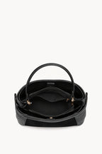 Kassandra & Co Borsa a mano effetto scamosciato con fascia decorativa